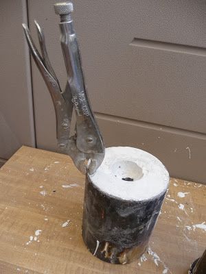 A flask being lifted after investment casting